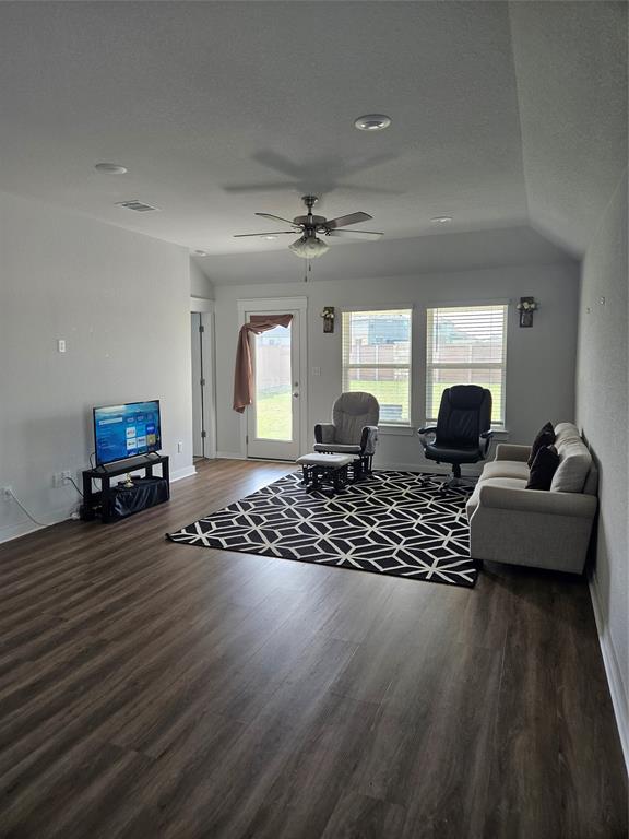 312 Gidran Trail Georgetown, TX 78626 - Photo 3 of 14 Living area featuring dark wood-finish flooring, recessed lighting, and a ceiling fan