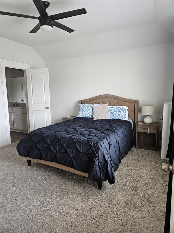 312 Gidran Trail Georgetown, TX 78626 - Photo 10 of 14 Carpeted room featuring a tray ceiling and ceiling fan