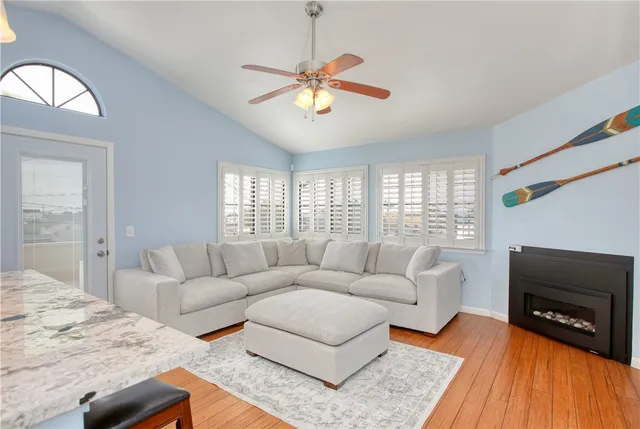 a kitchen with kitchen island granite countertop a table and chairs in it
