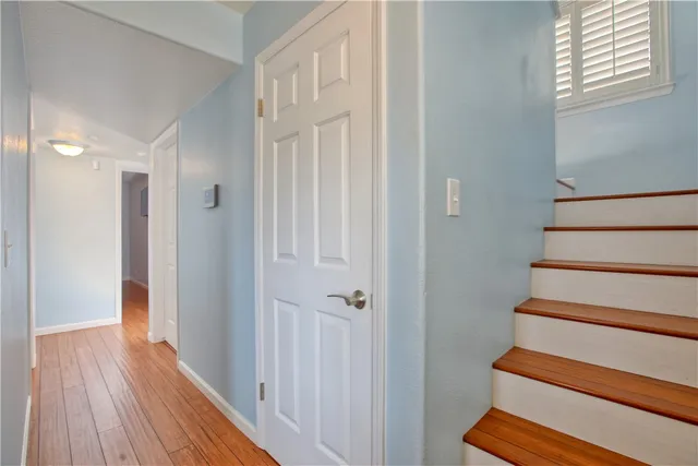 a bathroom with a tub shower sink and mirror