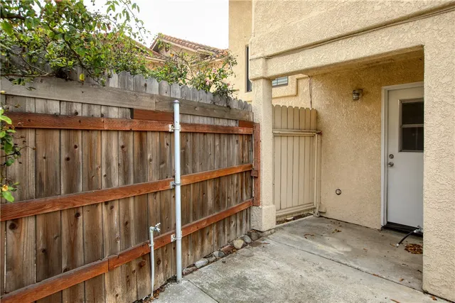 a view of a storage and utility room with washer and dryer