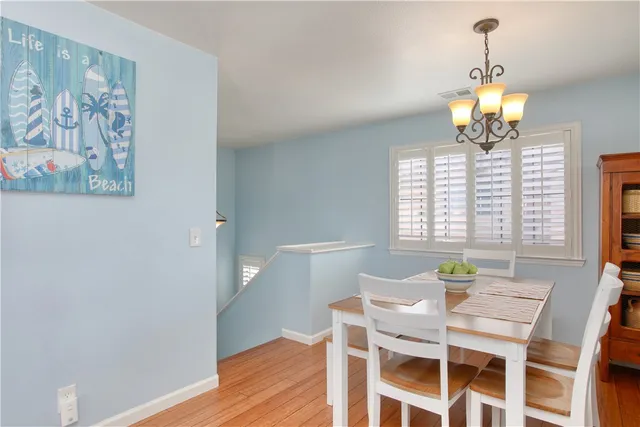a view of entryway with wooden floor and windows