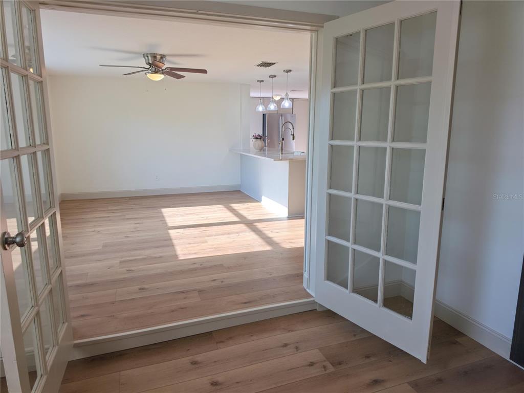 505 Red Mangrove Lane Apollo Beach, FL 33572 - Photo 18 of 24 a view of empty room with wooden floor and fan