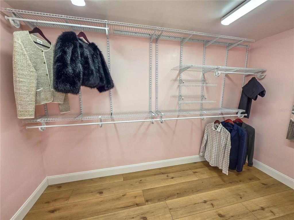 505 Red Mangrove Lane Apollo Beach, FL 33572 - Photo 21 of 24 a view of walk in closet with clothes and shoes