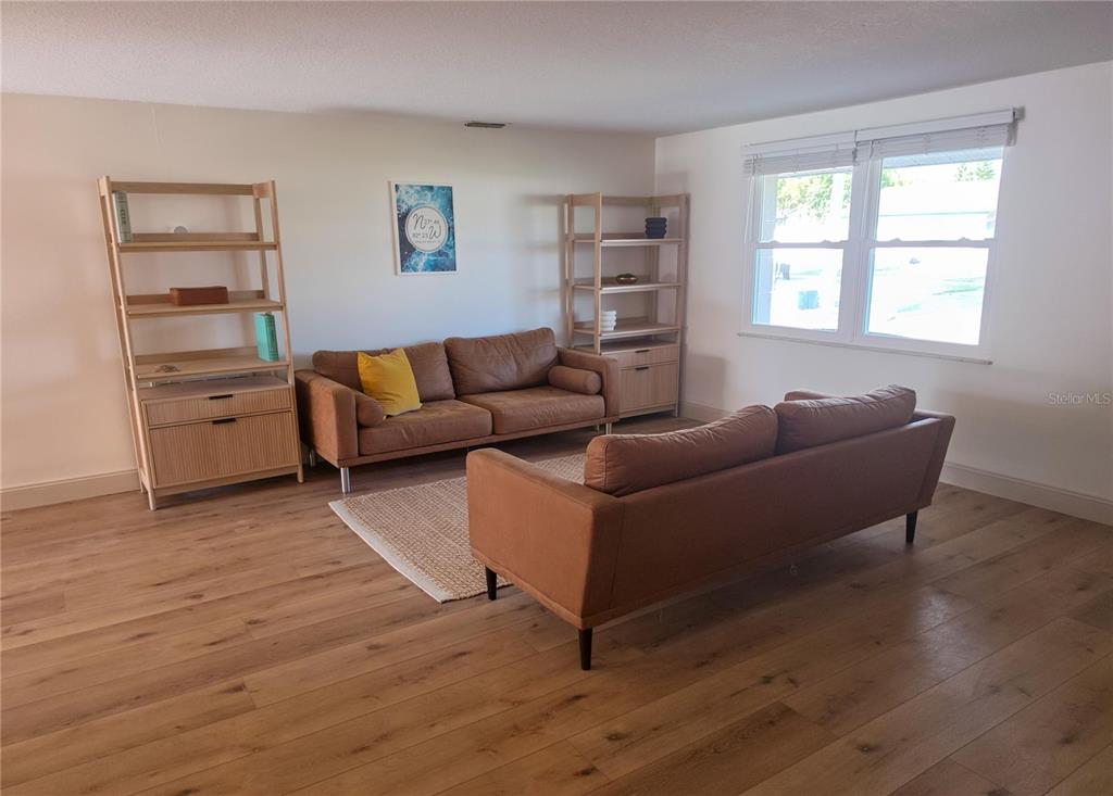 505 Red Mangrove Lane Apollo Beach, FL 33572 - Photo 7 of 24 a living room with furniture and a wooden floor