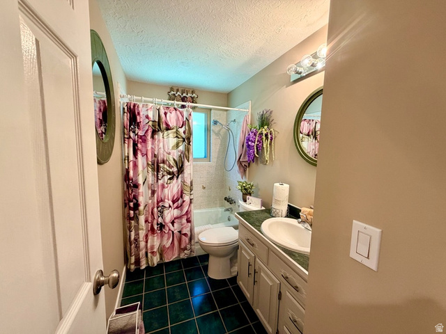 12080 Mill Ridge Circle Sandy, UT 84094 - Photo 12 of 56 Bathroom featuring a single vanity with a white basin sink, green countertop, and white cabinetry