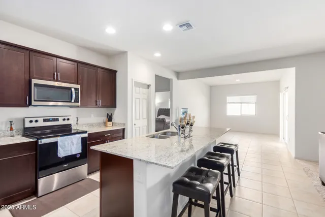 a living room with furniture rug and window