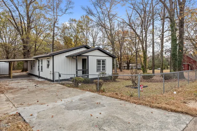 a backyard of a house with sink and trees