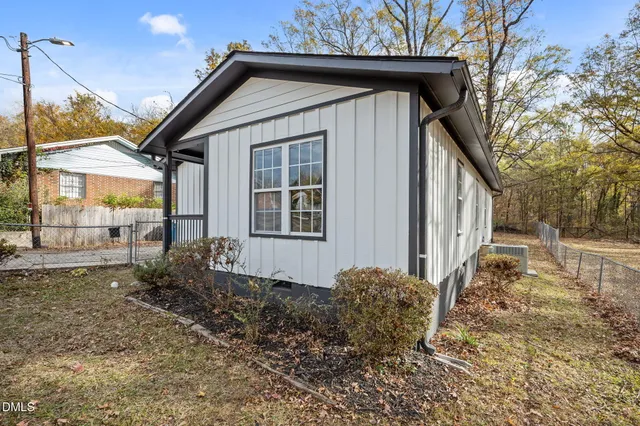 a backyard of a house with large trees
