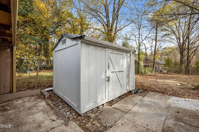 a view of a shaded area in a backyard