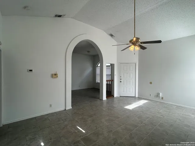a view of empty room with windows