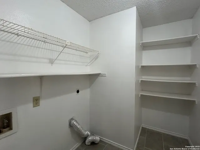 a view of a room with racks on the wall