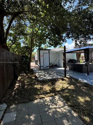 a backyard of a house with lots of green space