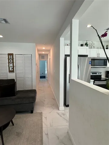 a view of a hallway view with staircase