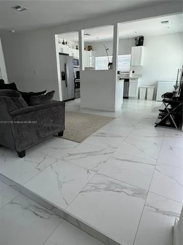 a living room with furniture and a couch