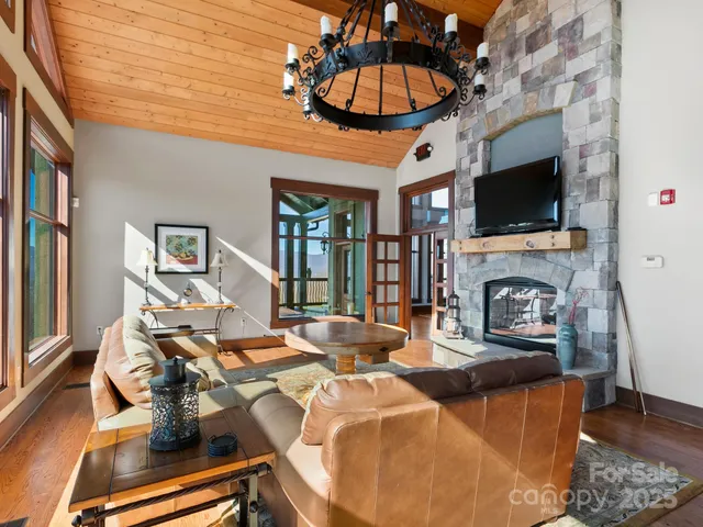 a living room with fireplace furniture and a flat screen tv