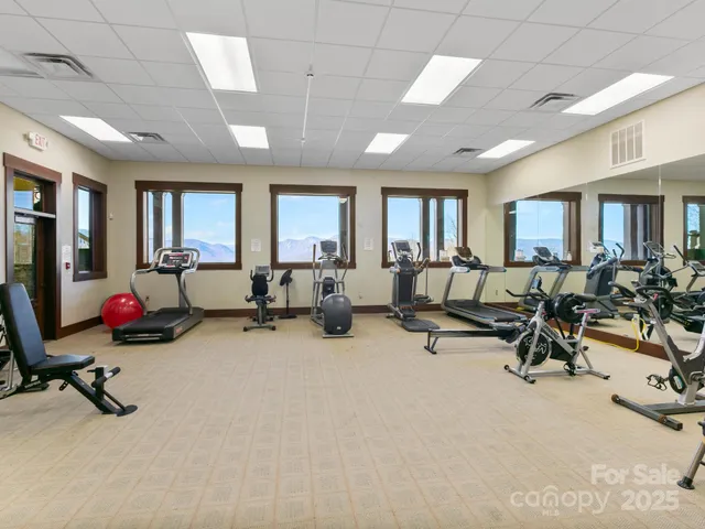 a view of a livingroom with workspace and a window