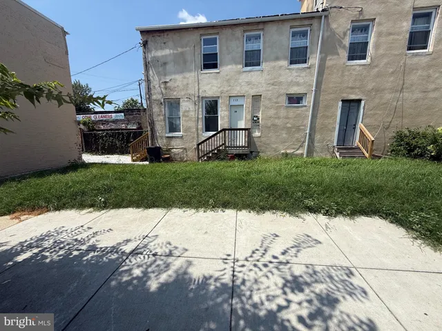 a view of street with parked cars