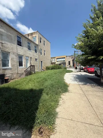 a view of a building with a yard
