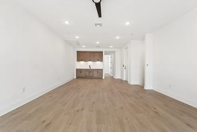 a view of kitchen with white cabinets