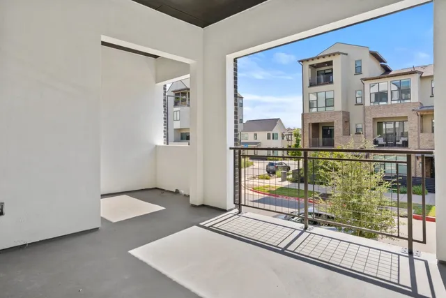 a view of an empty room with sliding glass door