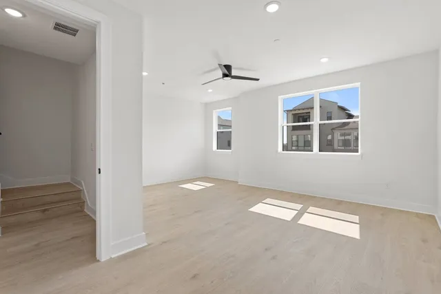 a bathroom with a double vanity sink a large mirror and shower