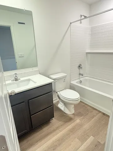 a bathroom with a sink a toilet and a bathtub