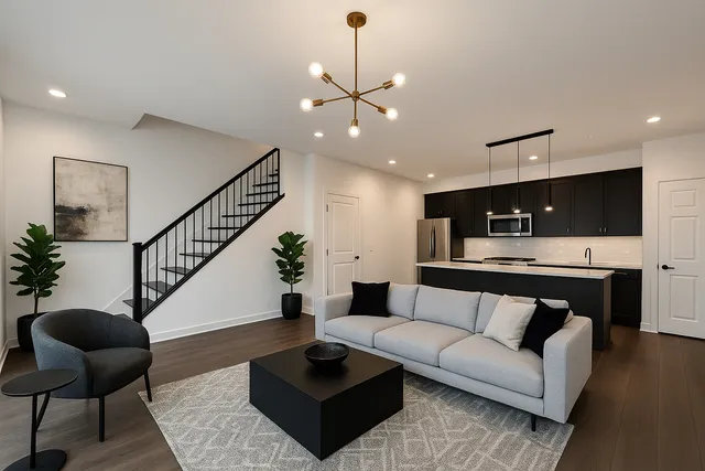 a living room with furniture and kitchen view