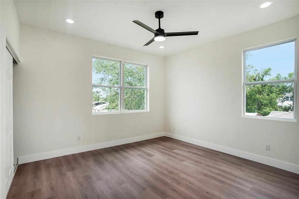 3612 Temple Street Tampa, FL 33619 - Photo 14 of 26 a view of a room with wooden floor and a window
