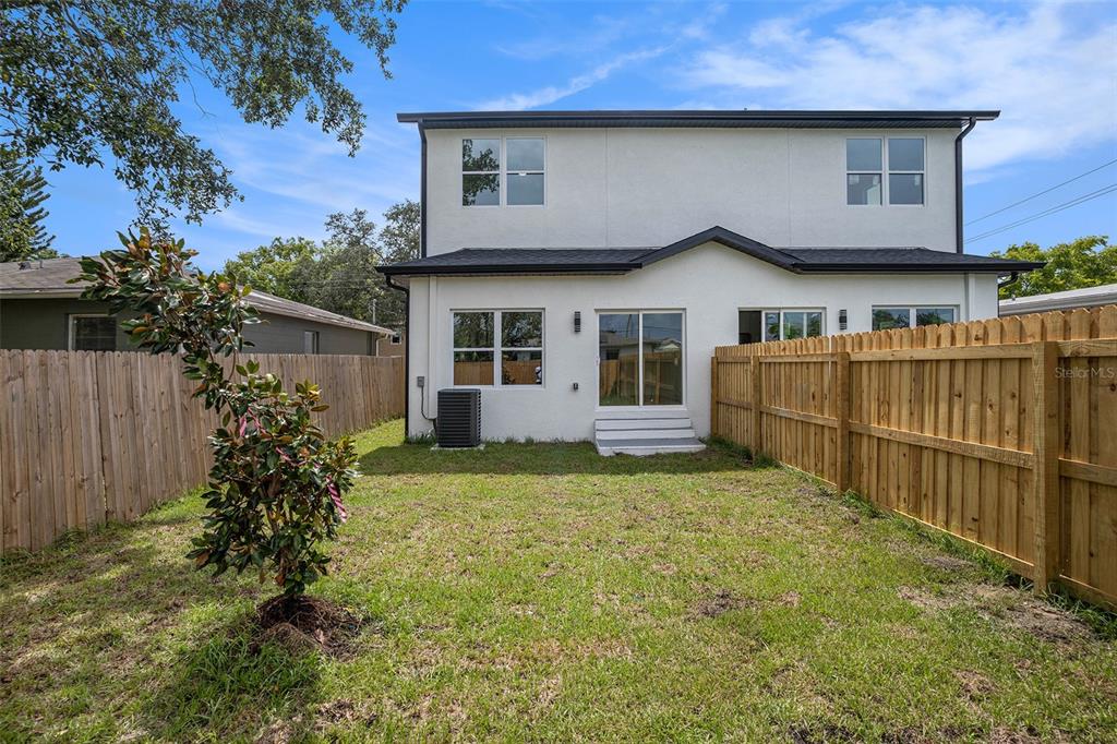 3612 Temple Street Tampa, FL 33619 - Photo 25 of 26 a house with wooden fence