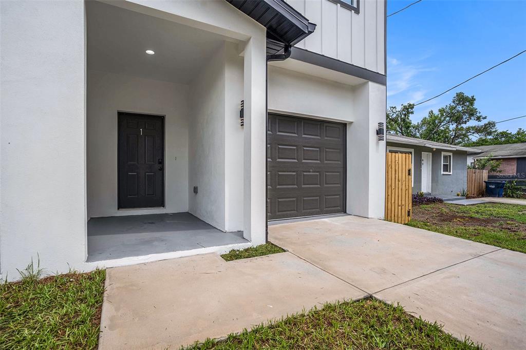 3612 Temple Street Tampa, FL 33619 - Photo 5 of 26 front view of a house with a yard
