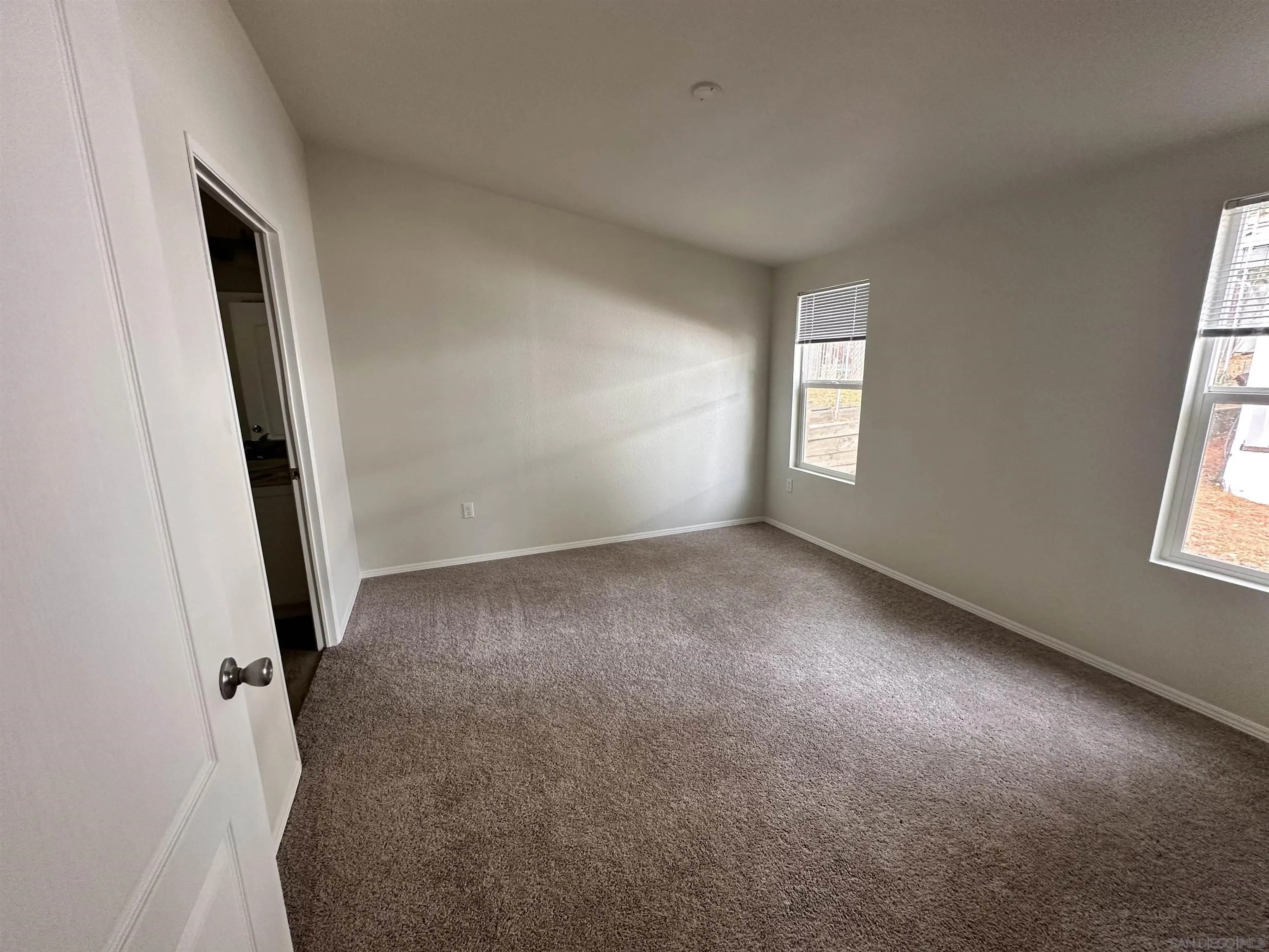 22899 Byron Road, Unit 29 Crestline, CA 92325 - Photo 8 of 8 an empty room with windows