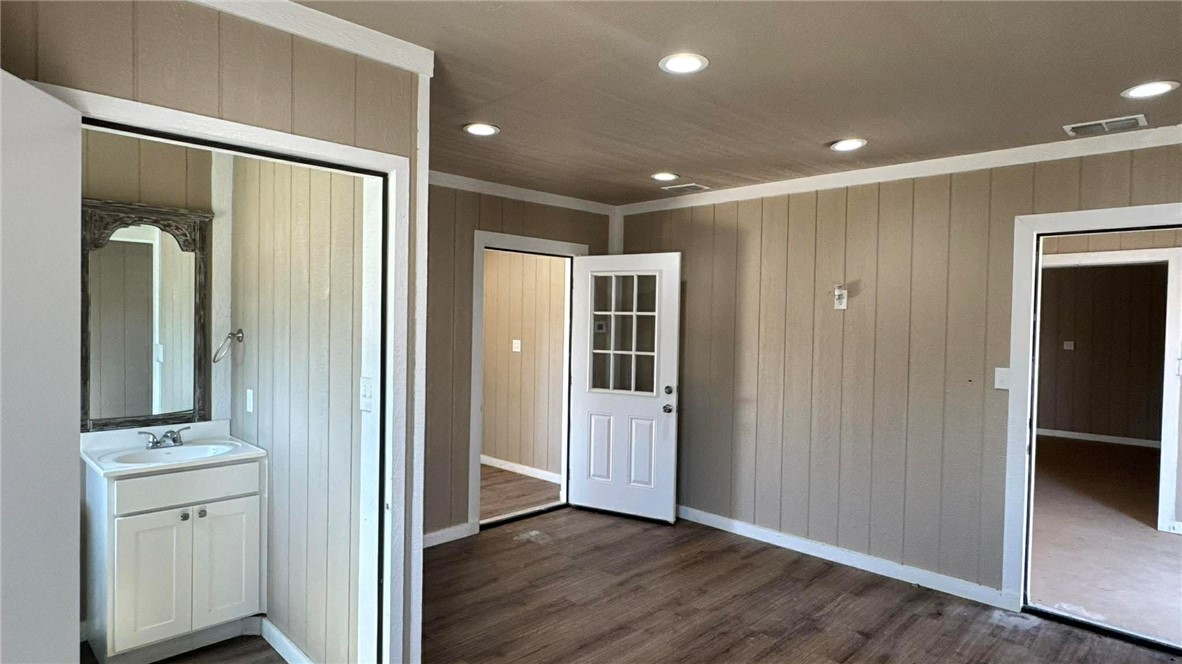 100 Patriots Place Somerville, TX 77879 - Photo 23 of 28 a view of a hallway with closet and wooden floor