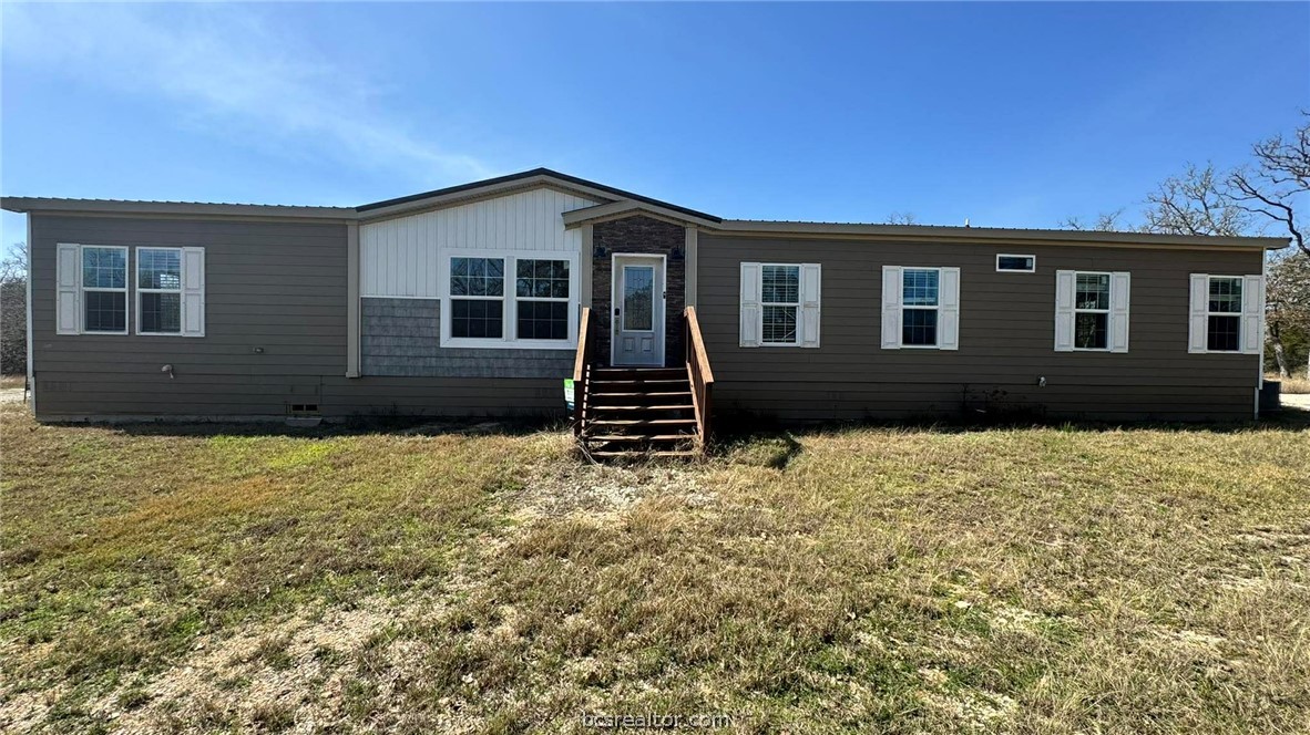 100 Patriots Place Somerville, TX 77879 - Photo 3 of 28 a house view with a garden space