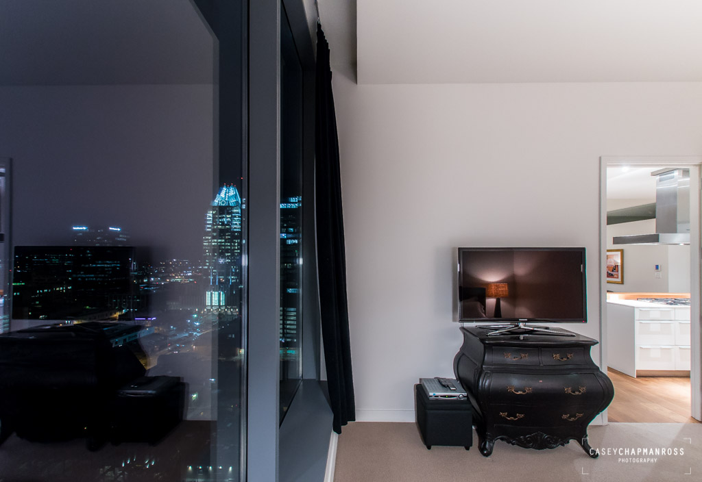210 Lavaca Street, Unit 1910 Austin, TX 78701 - Photo 25 of 40 a living room with furniture and a flat screen tv