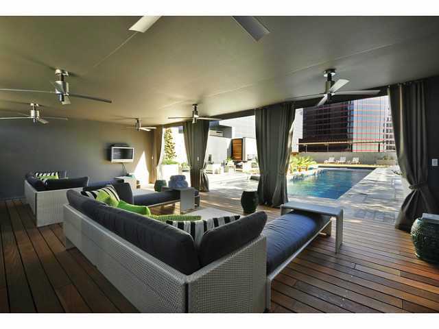 210 Lavaca Street, Unit 1910 Austin, TX 78701 - Photo 33 of 40 a living room with fireplace furniture and a wooden floor