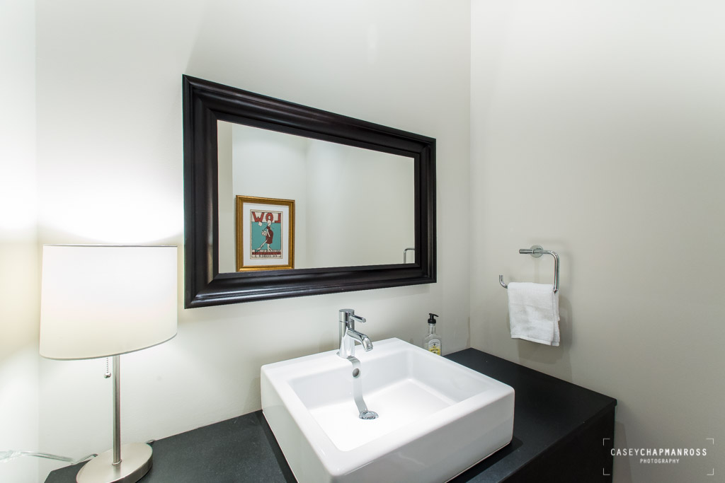 210 Lavaca Street, Unit 1910 Austin, TX 78701 - Photo 37 of 40 a bathroom with a sink and a mirror