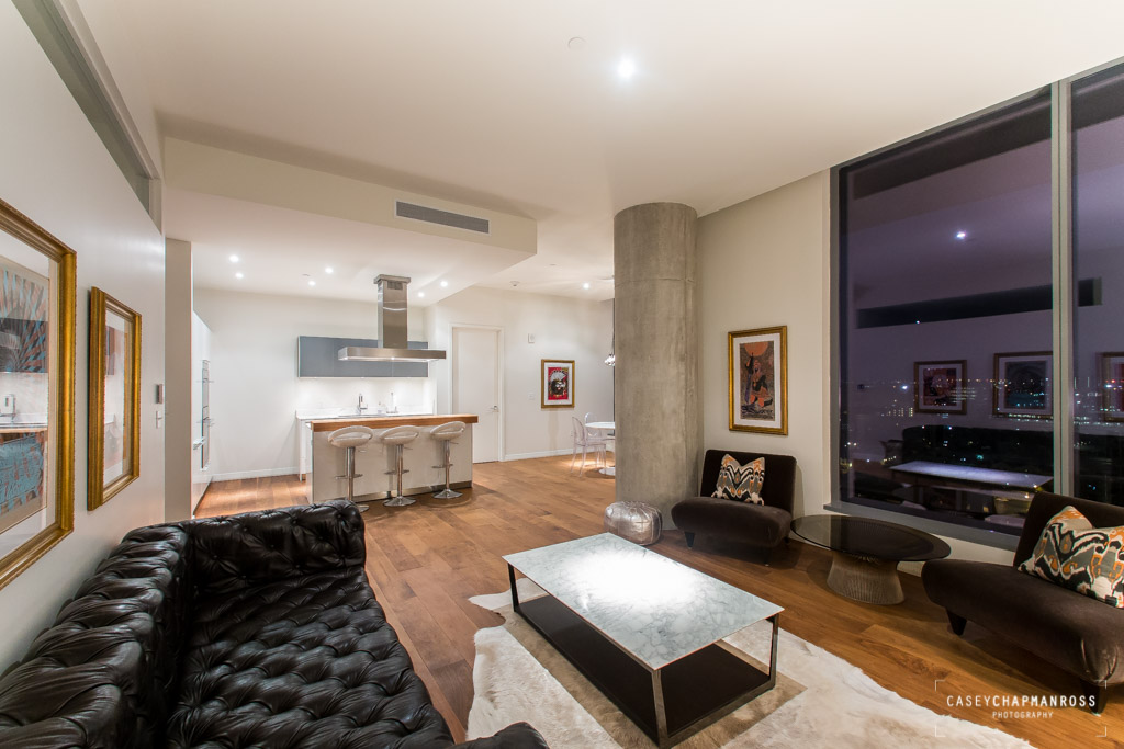210 Lavaca Street, Unit 1910 Austin, TX 78701 - Photo 4 of 40 a living room with furniture and a fireplace