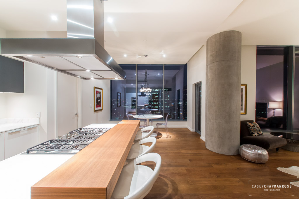 210 Lavaca Street, Unit 1910 Austin, TX 78701 - Photo 8 of 40 a living room with stainless steel appliances kitchen island granite countertop furniture and a kitchen view
