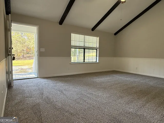 a view of a livingroom with furniture and chandelier