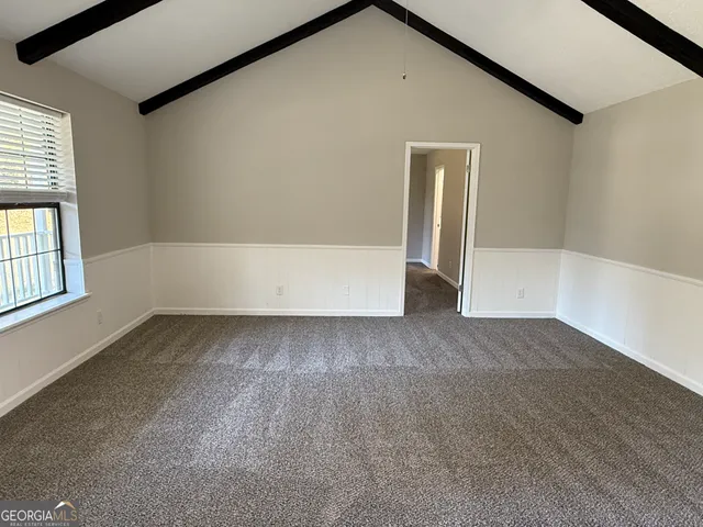 a view of a kitchen with a sink and dishwasher refrigerator freezer