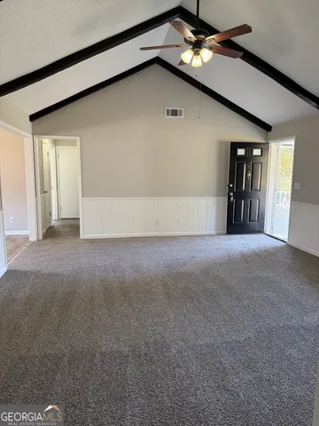 a kitchen with stainless steel appliances granite countertop a sink a stove and a refrigerator