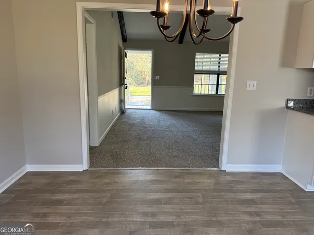 a kitchen with stainless steel appliances granite countertop a sink and a stove