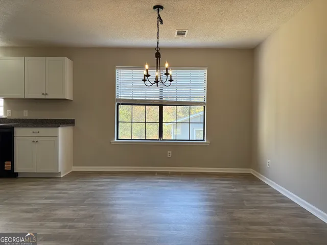 a kitchen with a stove and a microwave