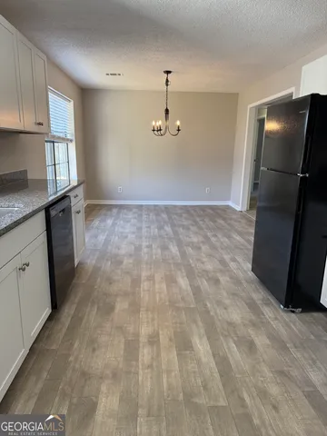 a view of storage and utility room with closet