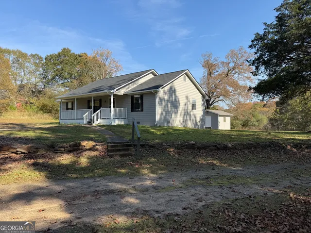 a view of a large house with a yard