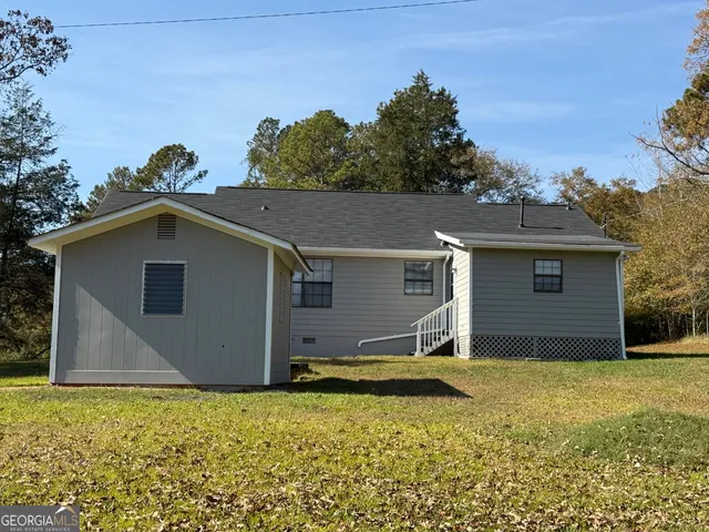 a view of a backyard of the house