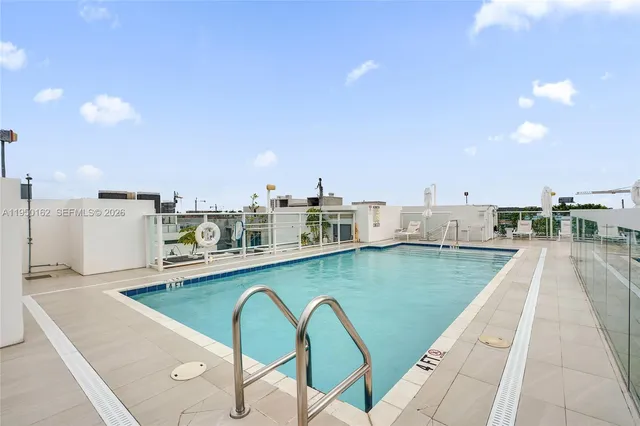 a view of a swimming pool and a balcony