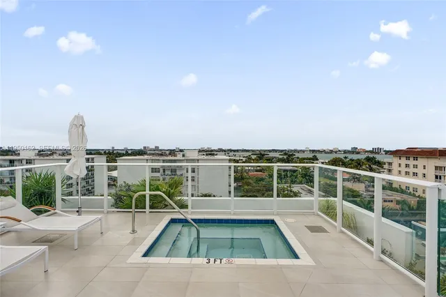 a view of a swimming pool with a lounge chair