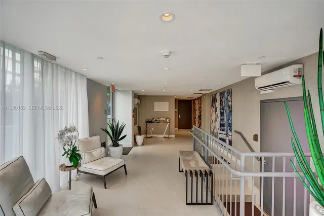 a balcony with table and chairs